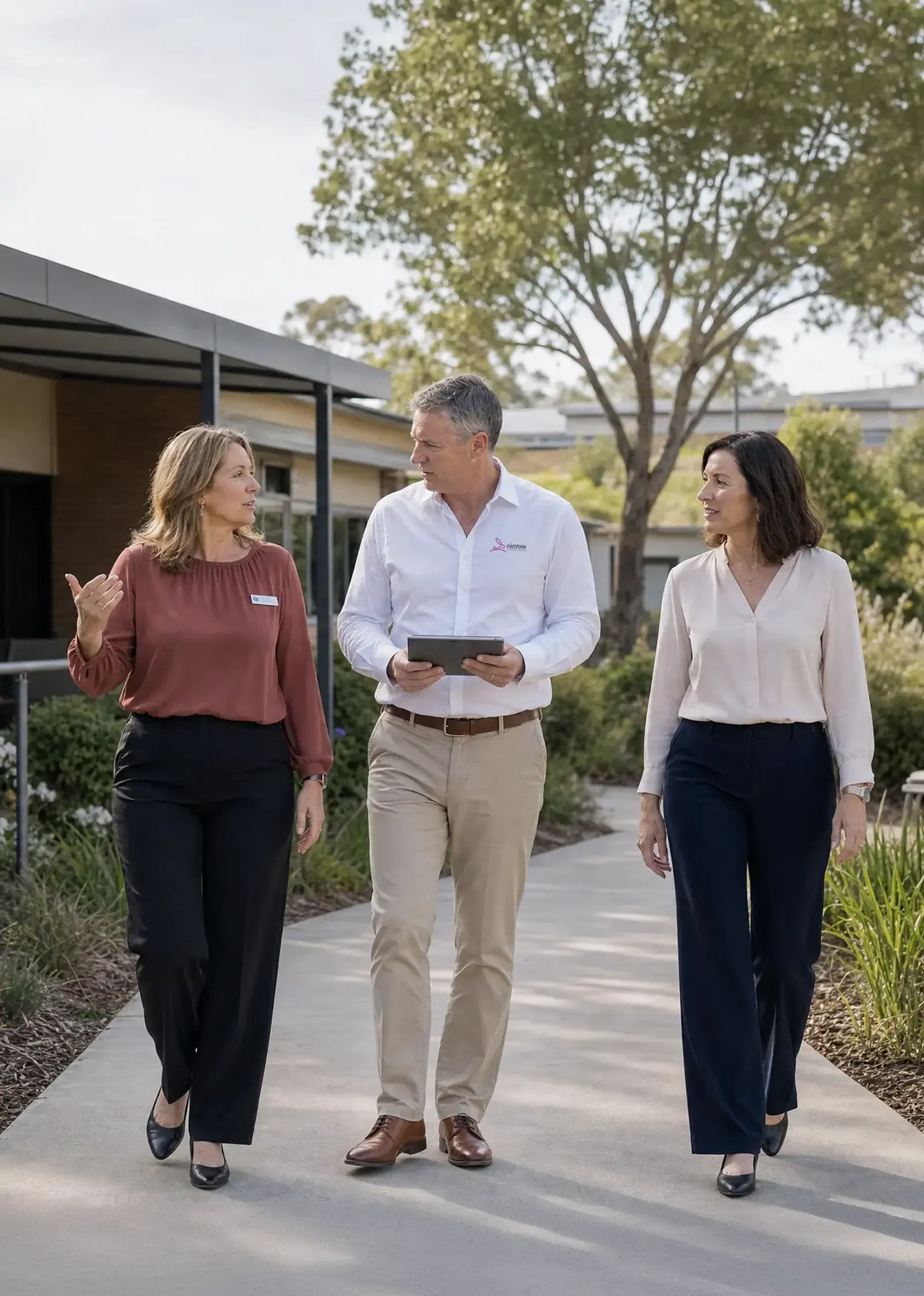 Nimble team discussing a commercial cleaning plan while walking through a facility